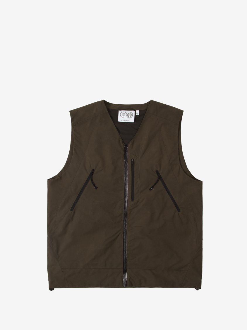Front view of weatherproof wax gilet with external placket and welded seams Detail of Halley Stevenson’s p200 washwax fabric used in technical outerwear Cygnus Gilet