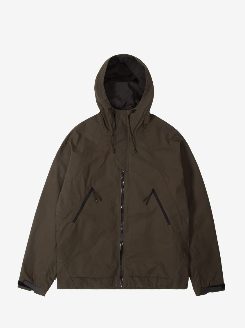 Front view of weatherproof wax jacket with external placket and welded seams Detail of Halley Stevenson’s p200 washwax fabric used in technical outerwear Cygnus Jacket