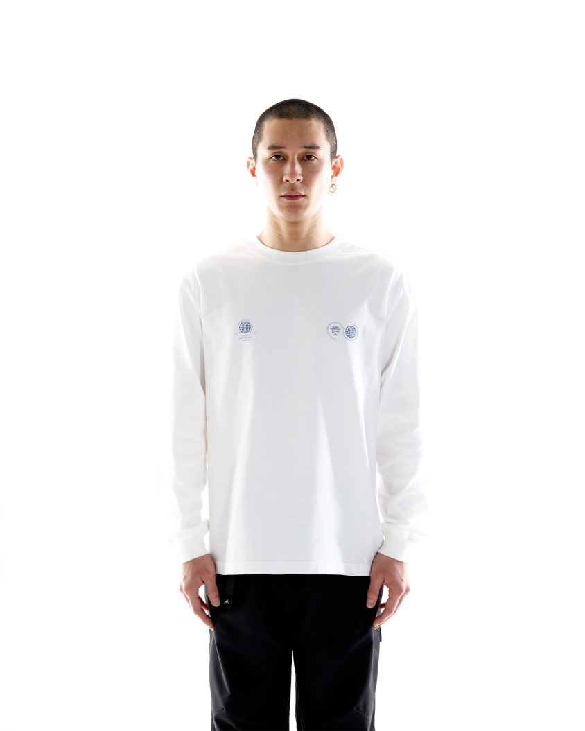 Model wearing White Cotton T-shirt . Globe LS Tee White
