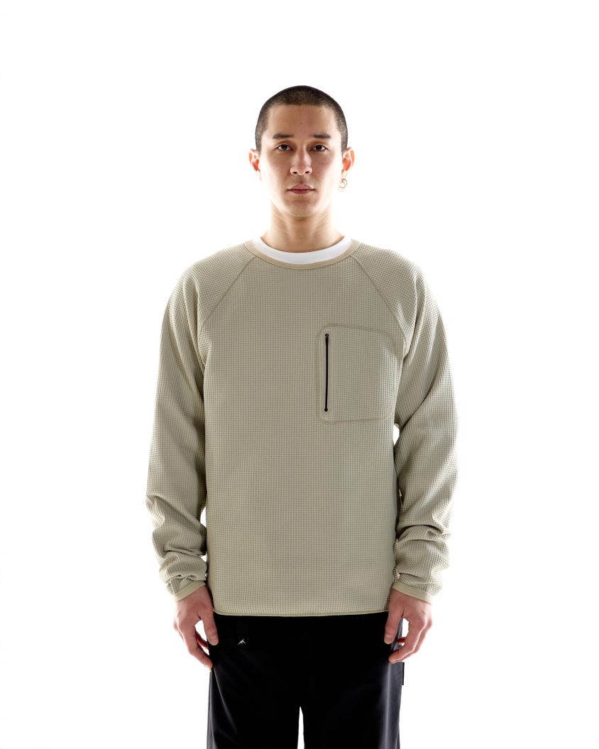 Model wearing Waffle LS Balaclava Jersey with compact hood and high placket
