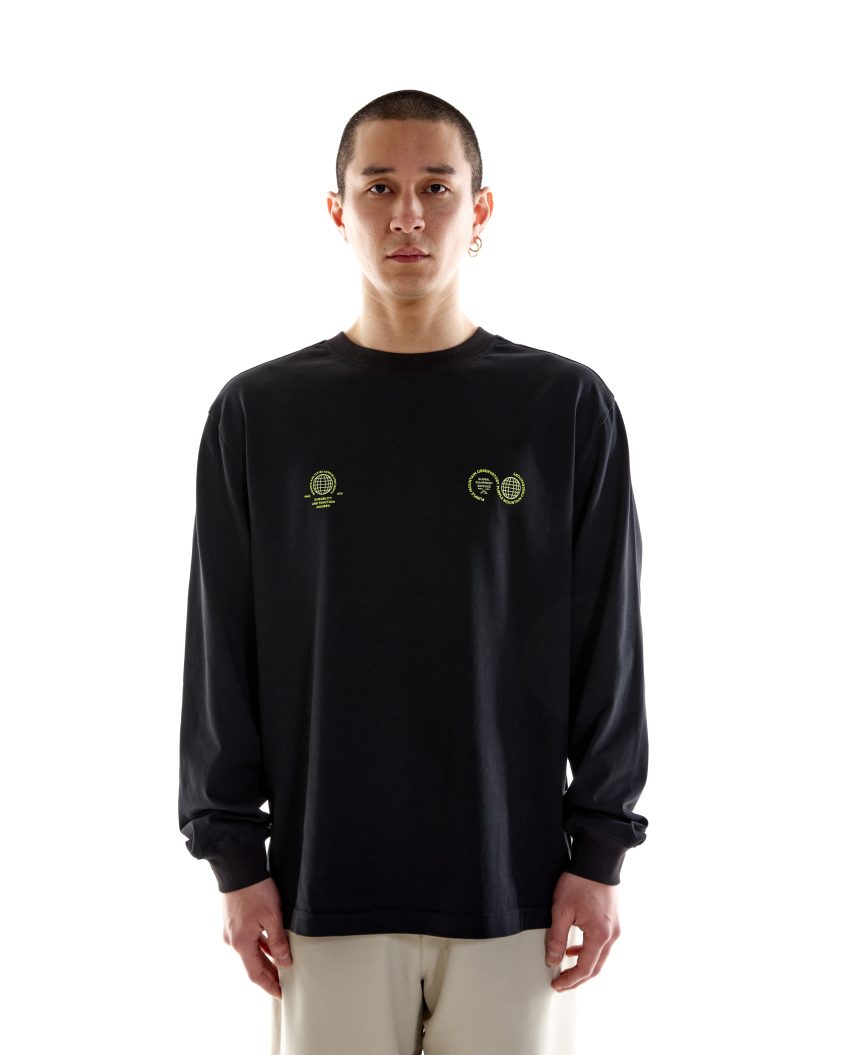 Model wearing White Cotton T-shirt . Globe SS Tee Black