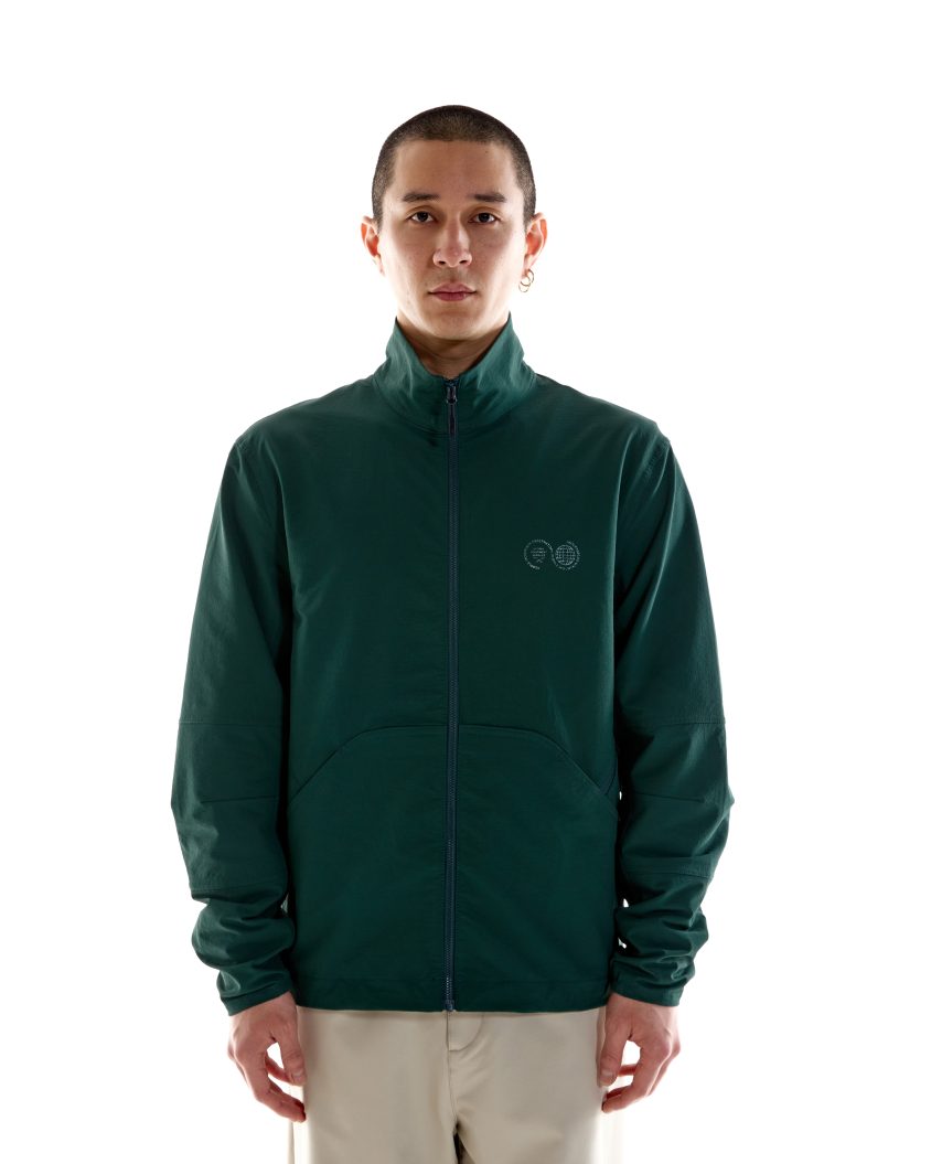 Model wearing Advanced Soft Shell – Pine Green with articulated fit Lightweight soft-shell jacket with adjustable hem toggles