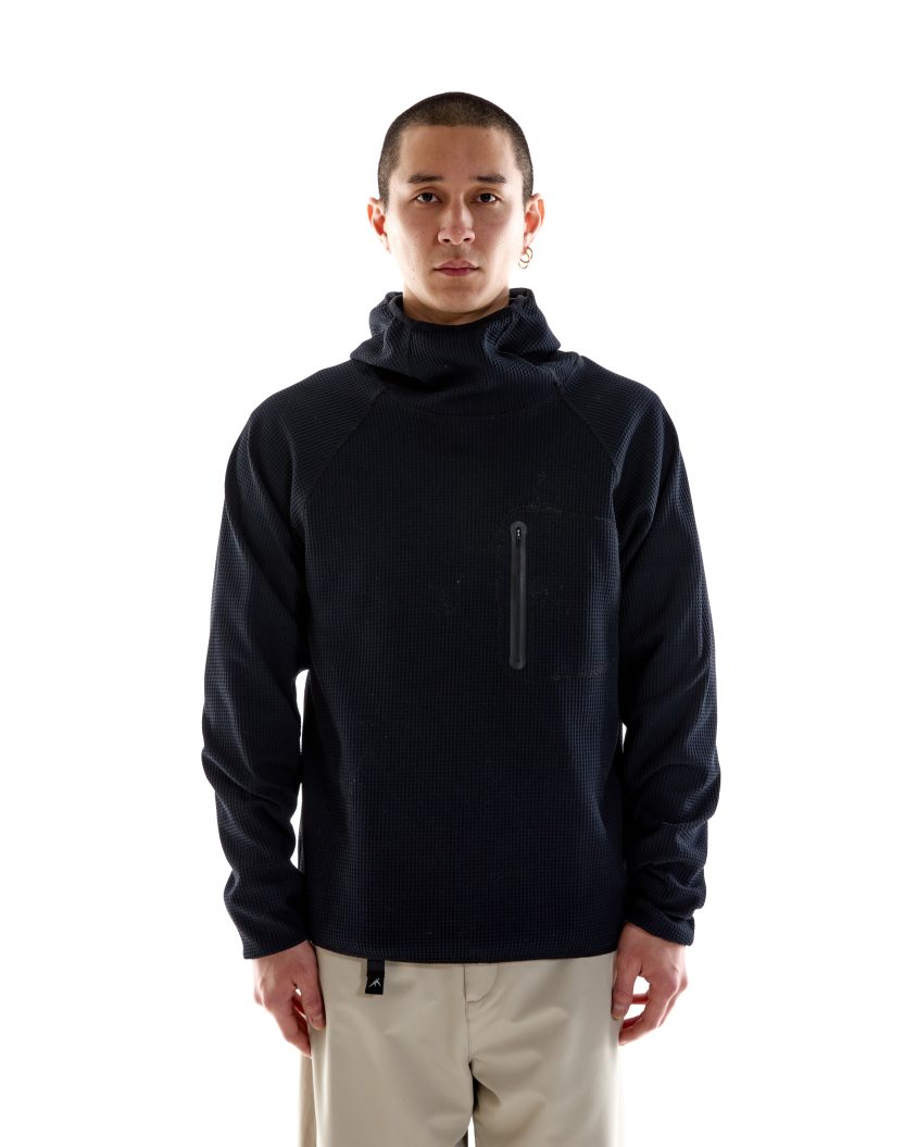Model wearing Waffle LS Balaclava Jersey with compact hood and high placket