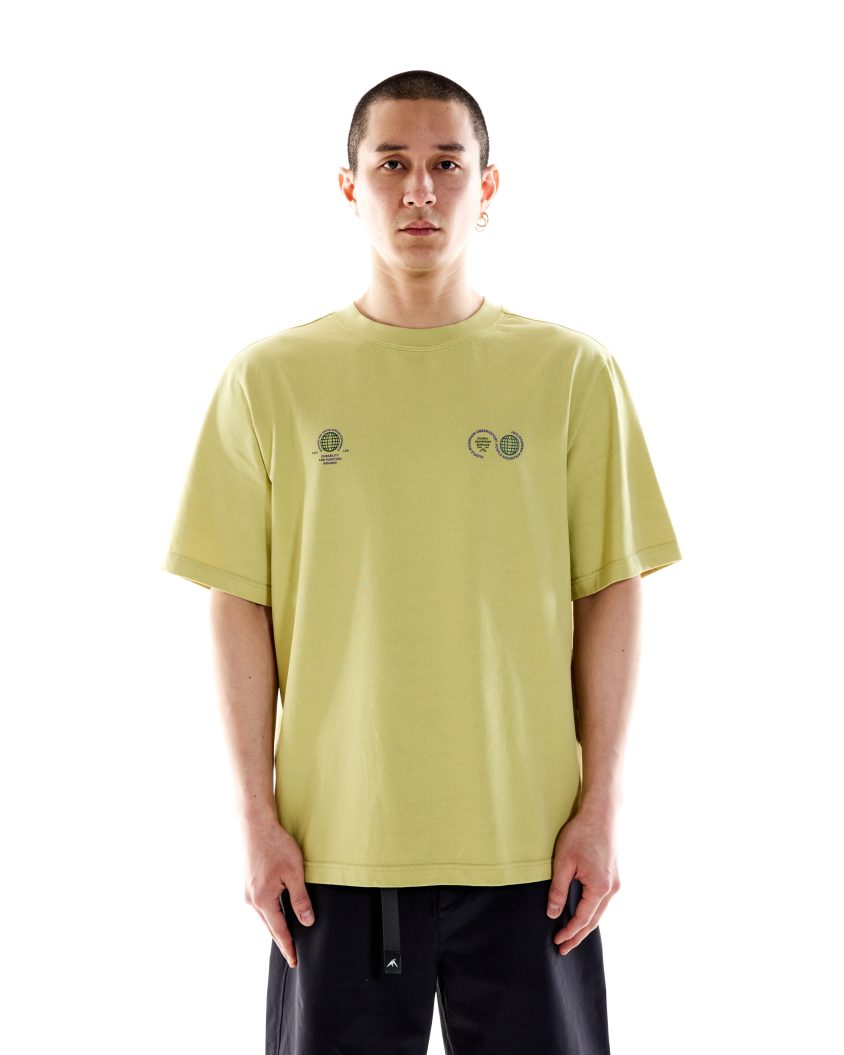 Model wearing White Cotton T-shirt . Globe SS Tee Sand