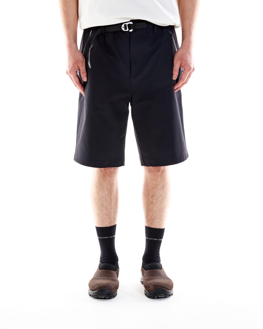 Model wearing Forest Short - Black. Durable, cotton Nylon Blend, Water Resistant.