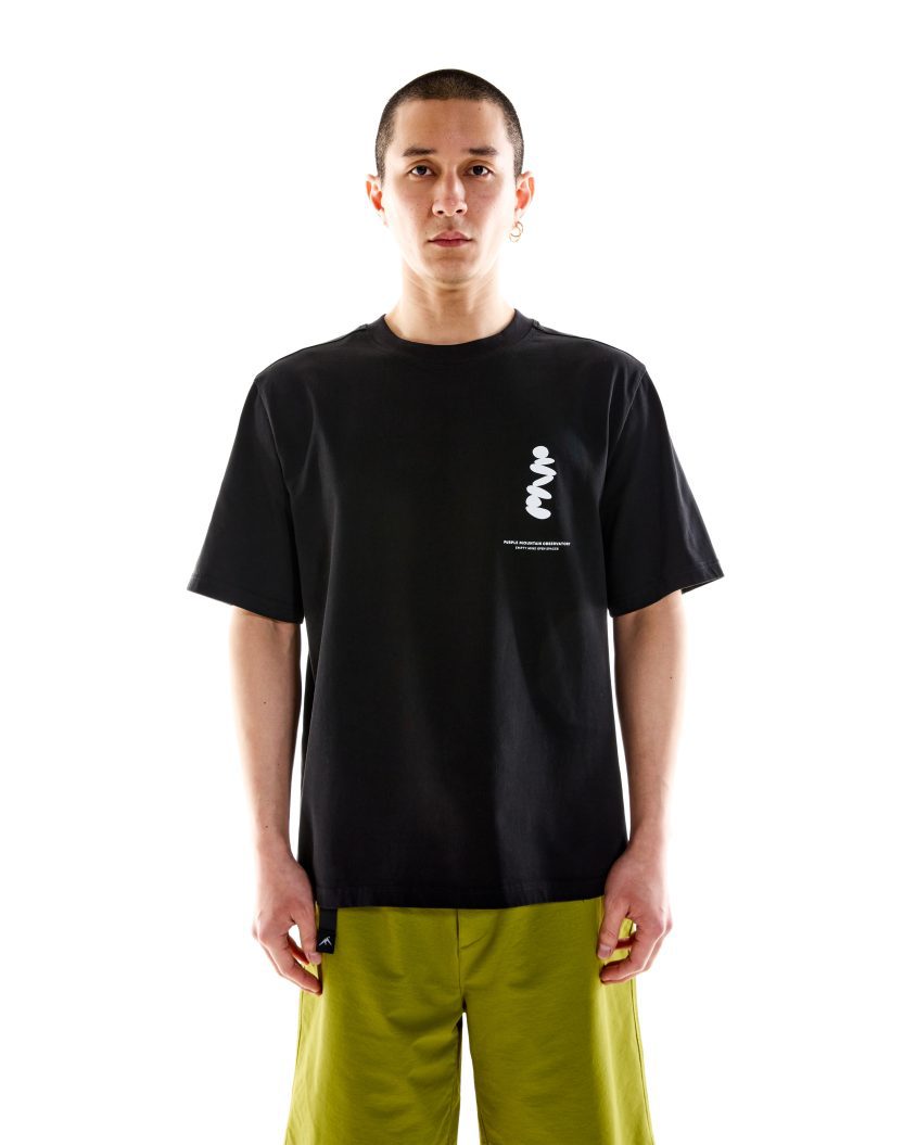 Model wearing Boulders SS Tee – White with graphic print on chest. premium heavyweight cotton