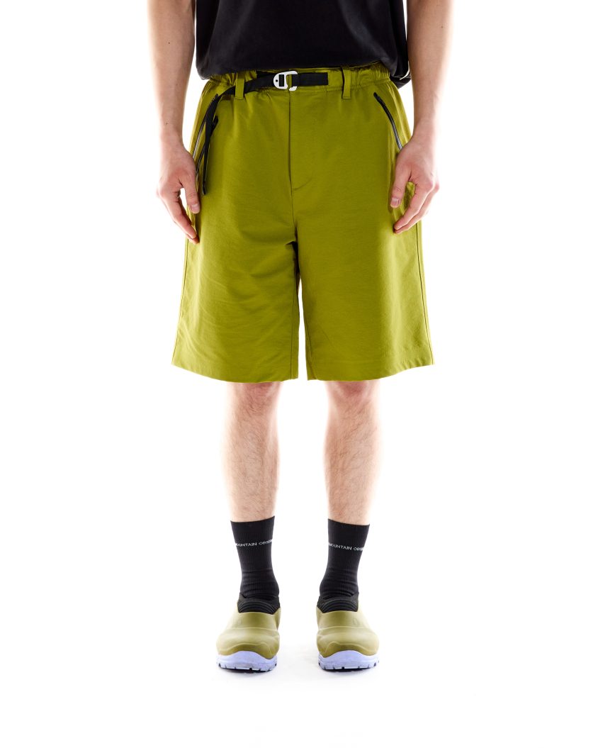 Model wearing Forest Short - Olive. Durable, cotton Nylon Blend, Water Resistant.